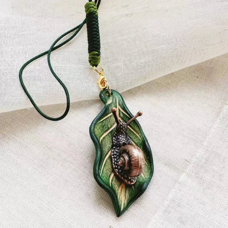 Handcrafted Leather Leaf & Bronze Snail Bag Charm – Unique Nature - Inspired Pendant | Artistic Handmade Accessory for Bags, Keys & Gifts - shewearing