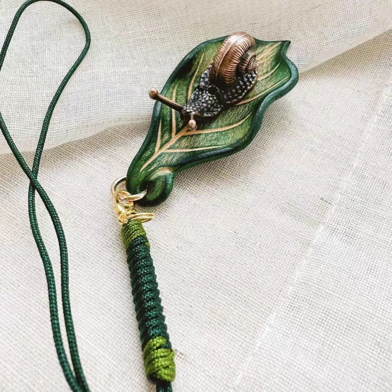 Handcrafted Leather Leaf & Bronze Snail Bag Charm – Unique Nature - Inspired Pendant | Artistic Handmade Accessory for Bags, Keys & Gifts - shewearing