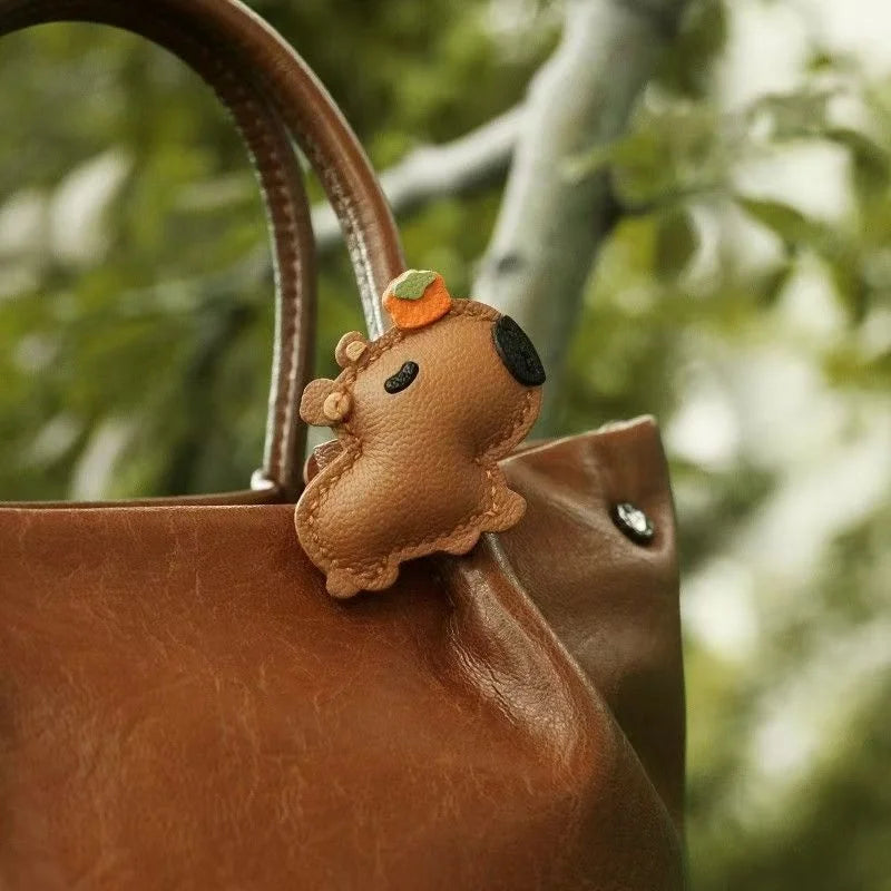 Lucky Capybara Leather Bag Charm – Handmade Sheepskin Capybara with Persimmon Hat | Adjustable Clip-On Pendant | Whimsical Good Luck Gift