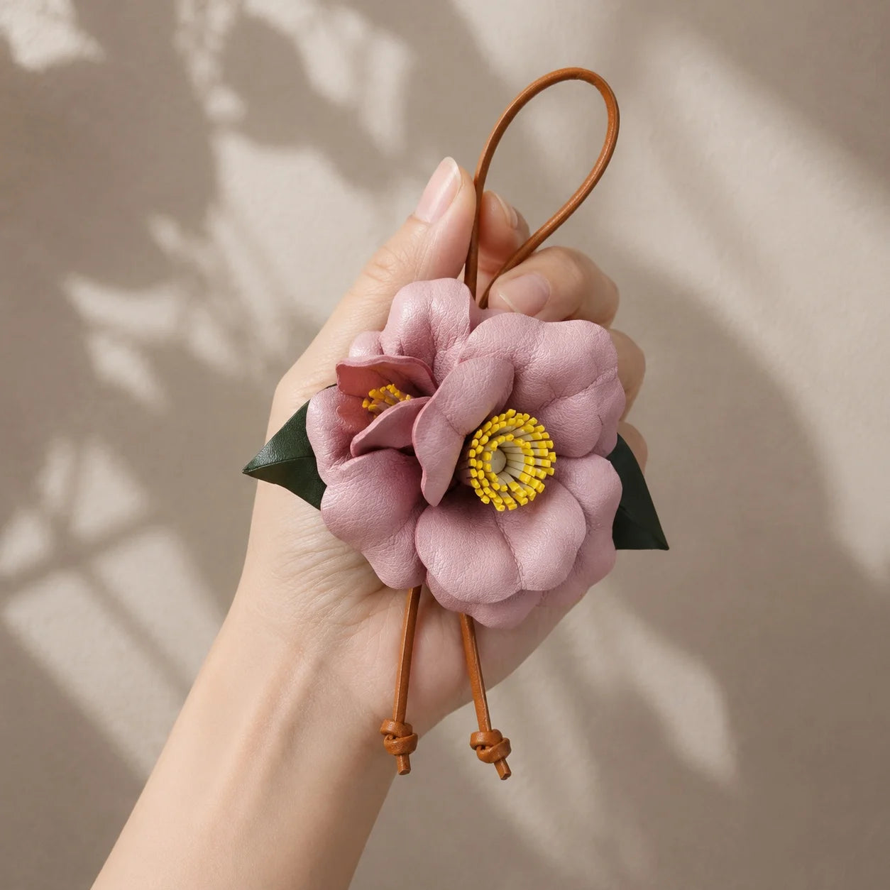 Handcrafted Leather Camellia Floral Bag Charm with Sculpted Double Blooms and Botanical Leaf Details for Handbags