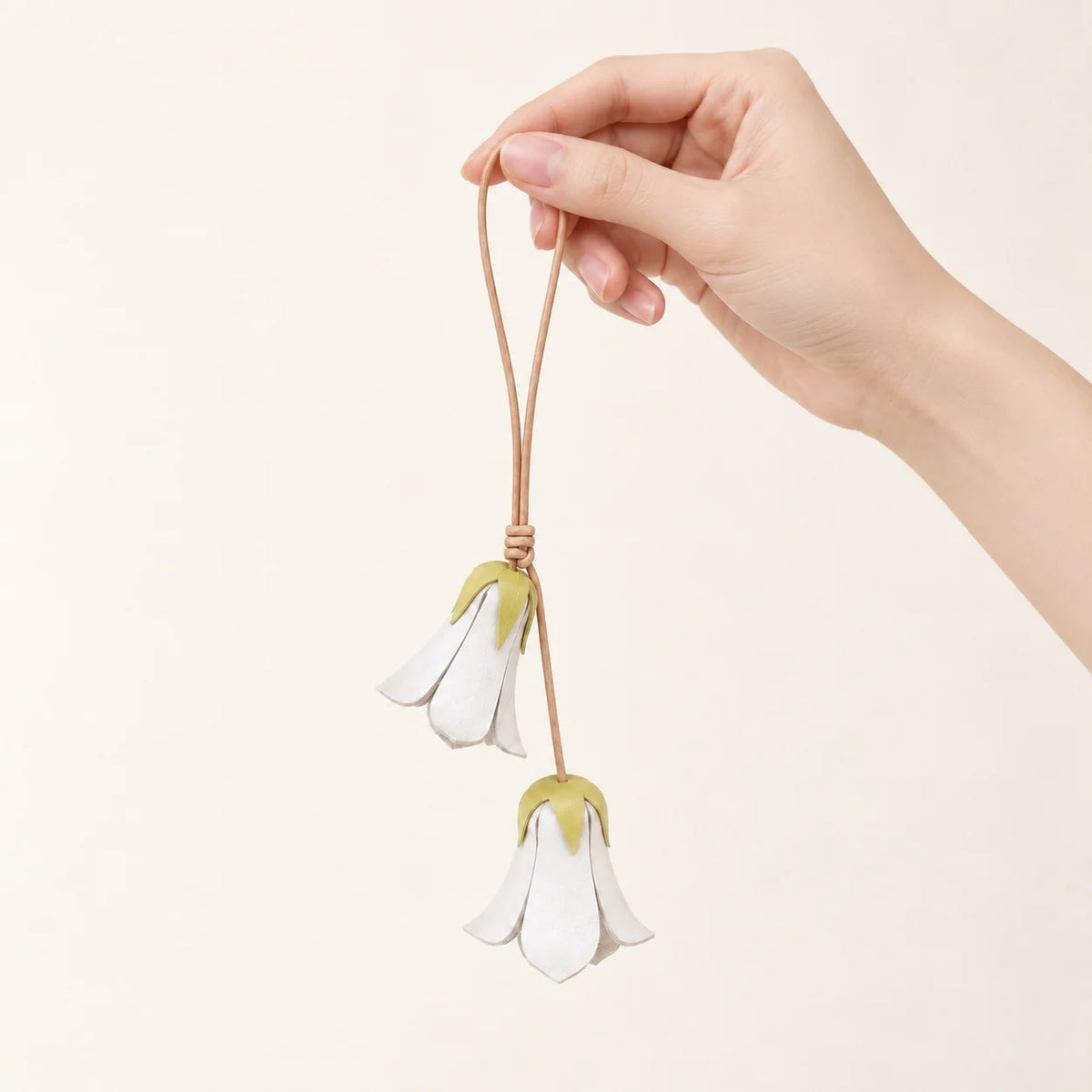 Handcrafted White Bellflower-Inspired Cowhide Leather Bag Charm with Twin Hanging Blooms, Slim Leather Cord and Soft Botanical Detail for Handbags