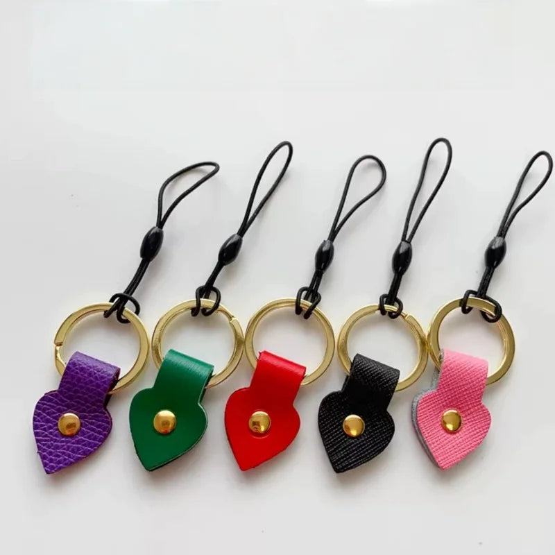 Handmade Leather Bow Lipstick Charm – Mini Bag Pendant with Keychain | Portable Cowhide Organizer for Lipstick, Coins & Accessories