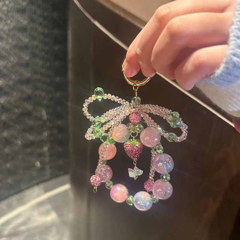 Strawberry Crystal Bow Phone Charm – Sweet Style Full Rhinestone Wrist Strap for Phones & Bags | Glittery Bag Pendant | Shiny Gift for Her