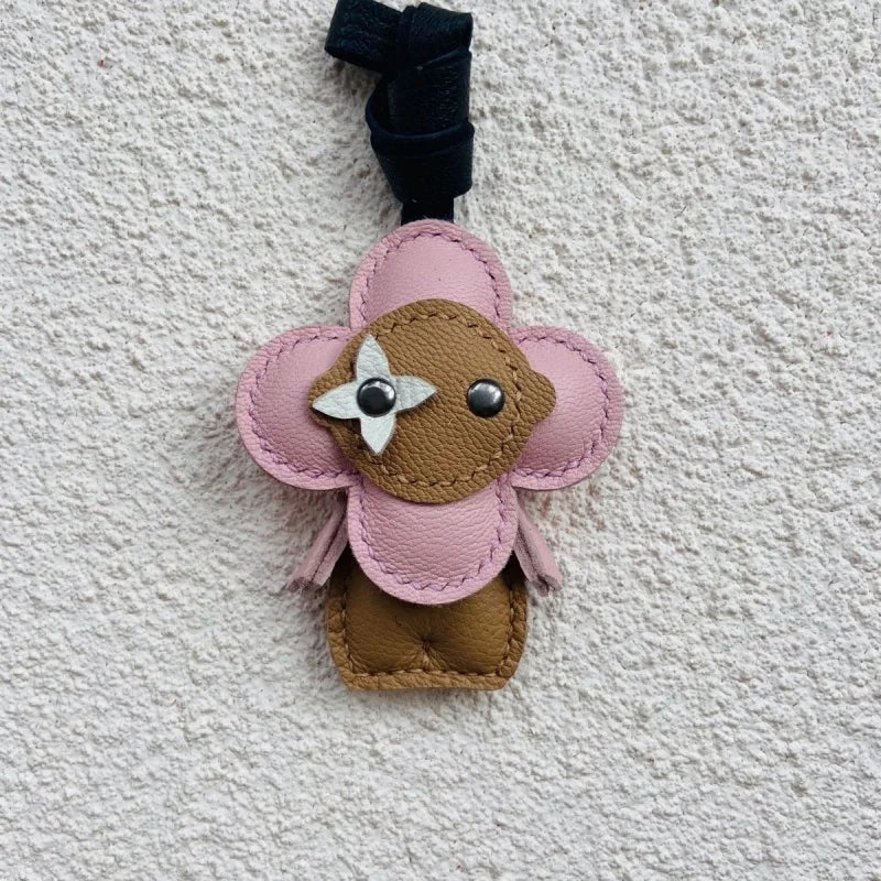 Clover Doll Sunflower Leather Bag Charm – Handmade French Lambskin Pendant | Whimsical Cartoon Keychain | Unique Luxury Accessory & Cute Gift for Women - shewearing