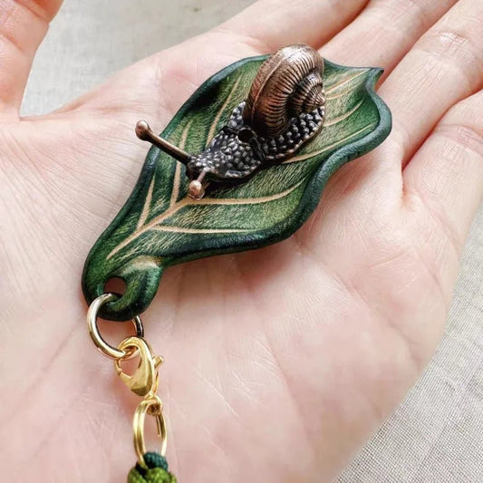 Handcrafted Leather Leaf & Bronze Snail Bag Charm – Unique Nature - Inspired Pendant | Artistic Handmade Accessory for Bags, Keys & Gifts - shewearing