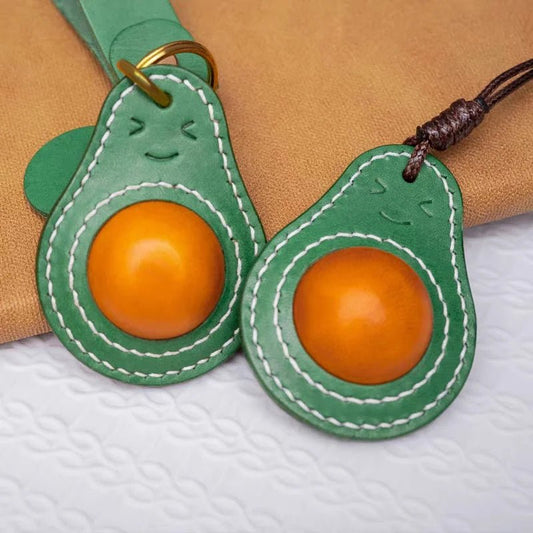 Smiling Avocado Leather Bag Charm – Handmade Italian Vegetable - Tanned Keychain | Whimsical Green Fruit Pendant | Cute Handbag Accessory for Women - shewearing