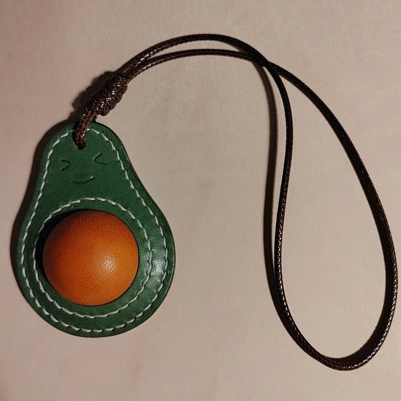 Smiling Avocado Leather Bag Charm – Handmade Italian Vegetable - Tanned Keychain | Whimsical Green Fruit Pendant | Cute Handbag Accessory for Women - shewearing